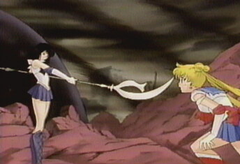 Saturn is NOT attacking sailor moon.... get it right... watch the series.....